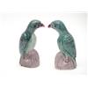 Image 1 : A pair of Kang Hsi famille verte biscuit porcelain figures of parrots, standing on aubergine glaz...