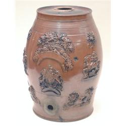 A pre-Victorian salt-glazed stoneware liquor barrel moulded with royal arms, lions and vines in b...