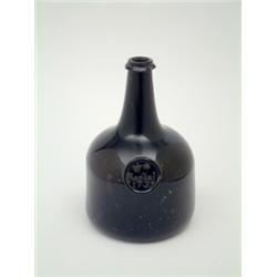 A George II mallet shape green glass bottle with seal inscribed Wm. Rendal 1739, 7.75ins. £1,200-...