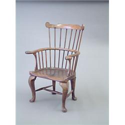 A George III elm and ash Windsor comb back armchair, Thames Valley, circa 1760-1770, with thin fl...