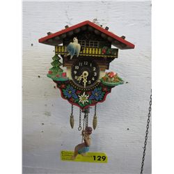 Cuckoo clock girl on a swing