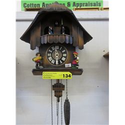 Cuckoo clock  - wood, with revolving figures