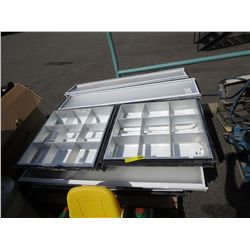 Skid of fluorescent light fixtures