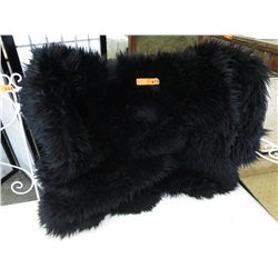 Black sheep skin rug