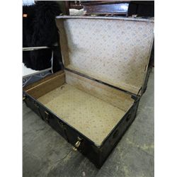 Vintage metal trunk with brass hardware