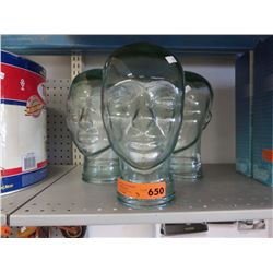 3 Clear glass heads. 11" tall, 7" dia.