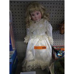 Collectible doll in white dress