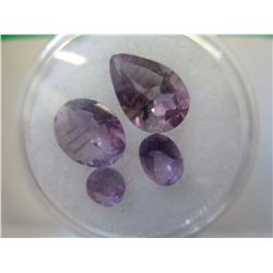 Gem jar fill with genuine assorted cut amethysts