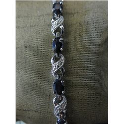 Ladies blue sapphire & diamond tennis bracelet