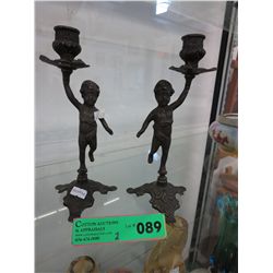 Pair of bronze Cupid candle holders