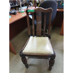 Antique oak chair with stretcher base
