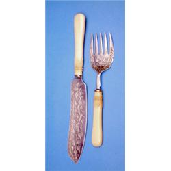 A pair of Victorian silver fish servers, with ivy engraved blades and carved ivory handles, Sheff...