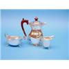 Image 1 : A George V silver hot water pot, a cream jug and a plated sauceboat £100-150...