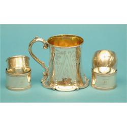 A Victorian silver christening can, engraved with foliate scrolls and 4 assorted napkin rings £75...