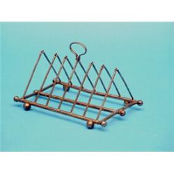 An Edwardian plated folding toast rack in the style of Christopher Dresser, with ball feet, 7ins...