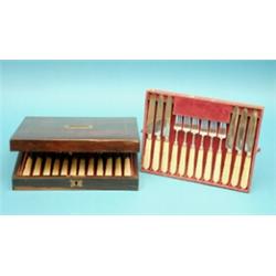 A set of 12 pairs of George IV silver dessert knives and forks, with carved ivory handles, Birmin...