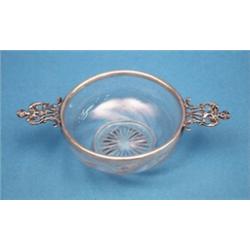 A Victorian silver mounted cut glass dish, with pierced cherub head handles, Maker William Comyns...