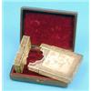 Image 1 : A Chinese filigree card case, applied with dragons and flowers, in leather case £60-80...