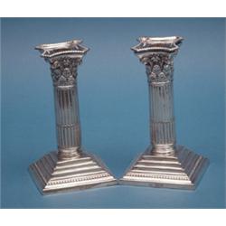 A pair of Victorian silver dwarf candlesticks with Corinthian stems, 6.25ins. Maker Mappin and We...