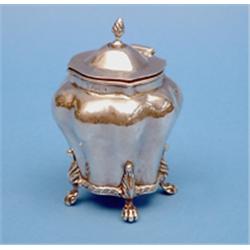 A late Victorian silver tea caddy, of lobed form with lion's paw feet, Chester 1895, 5ins. £200-3...