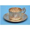 Image 1 : A French silver tea cup and saucer, with spiral fluting and foliate scroll decoration £100-150...