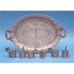 An Eastern European filligree drink set, comprising 6 glasses with holders and matching oval tray...