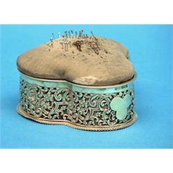 A late Victorian pierced silver casket, with pin cushion lid and scroll decoration 5ins £200-250...