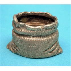 A Victorian novelty silver salt, modelled as an open sack, 1874 2.5ins £150-200...