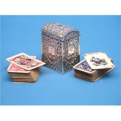 An Edwardian silver playing card case, with scroll decoration and two packs of cards 3ins £150-20...