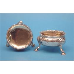 A George III silver bun salt, with pad feet, 1774; and a similar salt, 1828 £70-100...