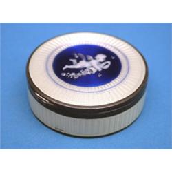 An enamelled silver pill box, of circular form decoration with a cherub 1.75ins £70-100...