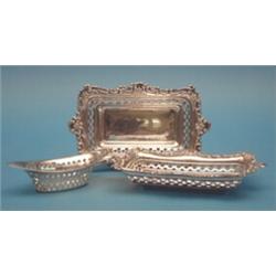 A pair of George V silver trinket dishes, with pierced decoration, 6.5ins; and an elliptical dish...