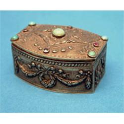 A Continental gilt metal snuff box, applied with turquoise and garnets 2ins £100-150...