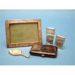 A Victorian silver etui, lacking fittings, a vesta case, a photo frame, a tortoiseshell cigarette...