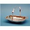 Image 1 : A George V silver cake basket, of serpentine rectangular form with swing handle 10ins £250-300...