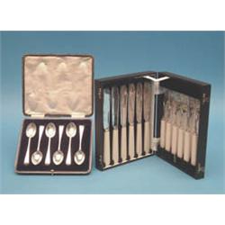 A set of 6 George V silver teaspoons, Old English pattern, and a set of 6 plated fish knives and...