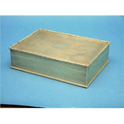 A George V rectangular silver cigarette box, engine turned with flowerhead border, with divided i...