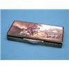 Image 1 : An George V enamelled silver compact, decorated with pastoral lovers beside a river 3.25ins £200-...