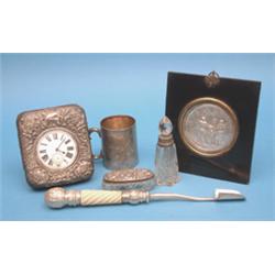 A group of small silver, including a silver mounted travelling timepiece, a framed plaque inscrib...