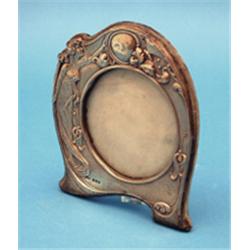An Edwardian art nouveau silver photo frame, decorated with a maiden and butterflies, Birmingham...