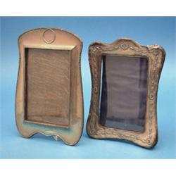An Edwardian silver mounted photo frame, 8.5ins; and a similar frame with harebell decoration, 7....