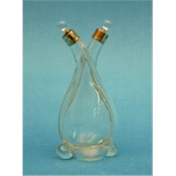An Edwardian silver mounted glass oil and vinegar bottle and a plated toast rack £50-70...