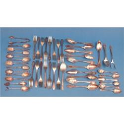 A set of 10 silver coffee spoons and tongs, with pierced handles, together with a group of associ...
