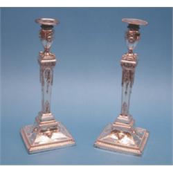 A pair of old Sheffield plate candlesticks, of Adam design decoration with classical motifs, on s...