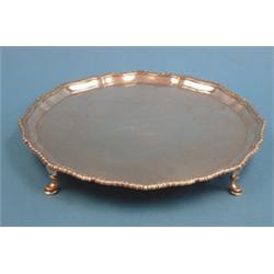 A George V silver salver, with gadrooned rim and pad feet, 1933, (17.5ozs) £150-200...