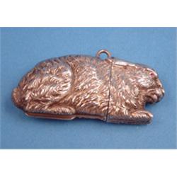 A Continental novelty vesta case, modelled as a rabbit with gem set eyes £300-400...