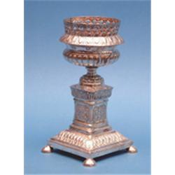 A Continental silver urn, with pierced rim, loop handles and pedestal foot 9.5ins £100-150...