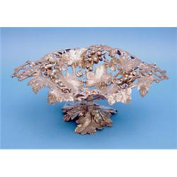 A plated centrepiece bowl, of vineous design with rustic handles, 14ins. £100-150...