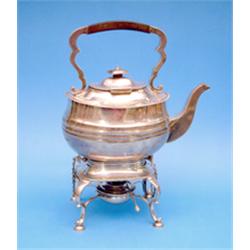 A George V silver kettle on stand of rounded rectangular form with burner gross 62oz £500-600...