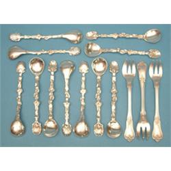 A set of 11 Dutch silver salt spoons, together with 3 cake forks £60-80...